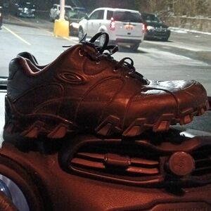 Black Athletic Shoes with Sleek Design and Traction Sole